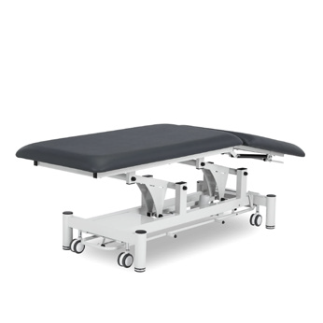 Camilla eléctrica para fisioterapia Plus con barra perimetral, 195 x 66 cm. Tapizado gris y base color blanco Camilla eléctrica para fisioterapia Plus con barra perimetral, 195 x 66 cm. Tapizado gris y base color blanco